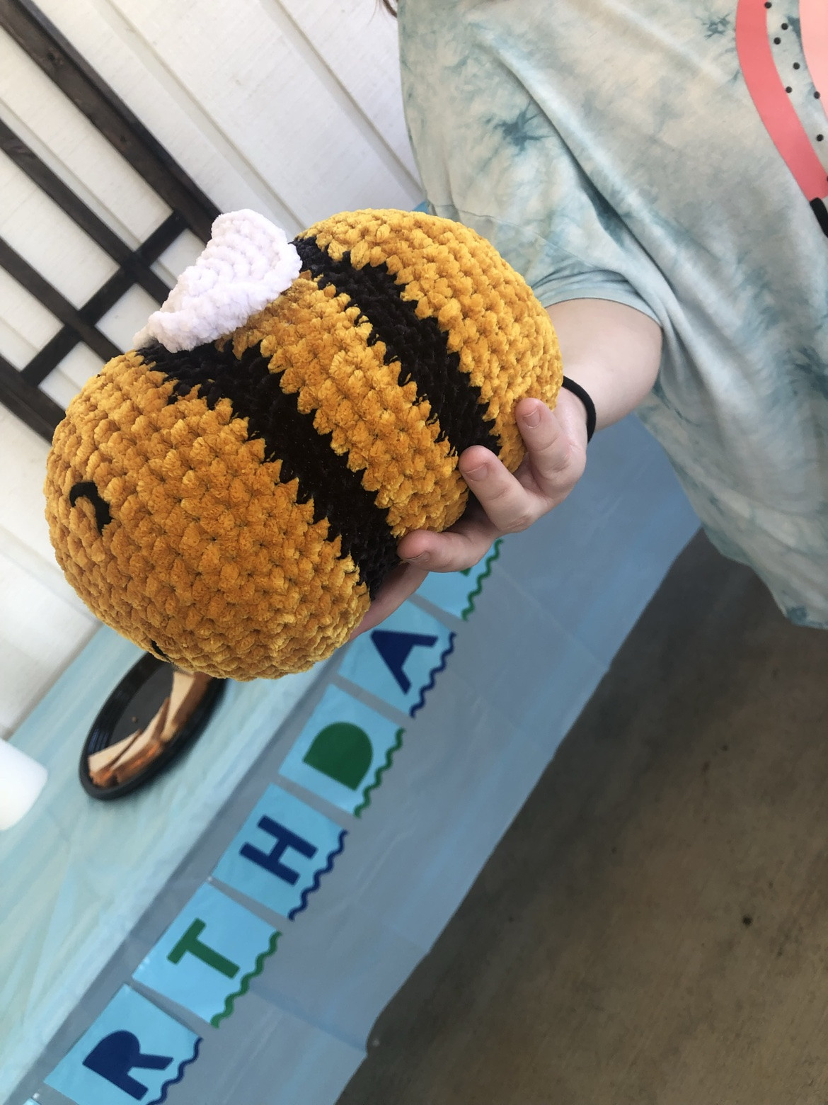 Black, white, and golden yellow striped crochet project