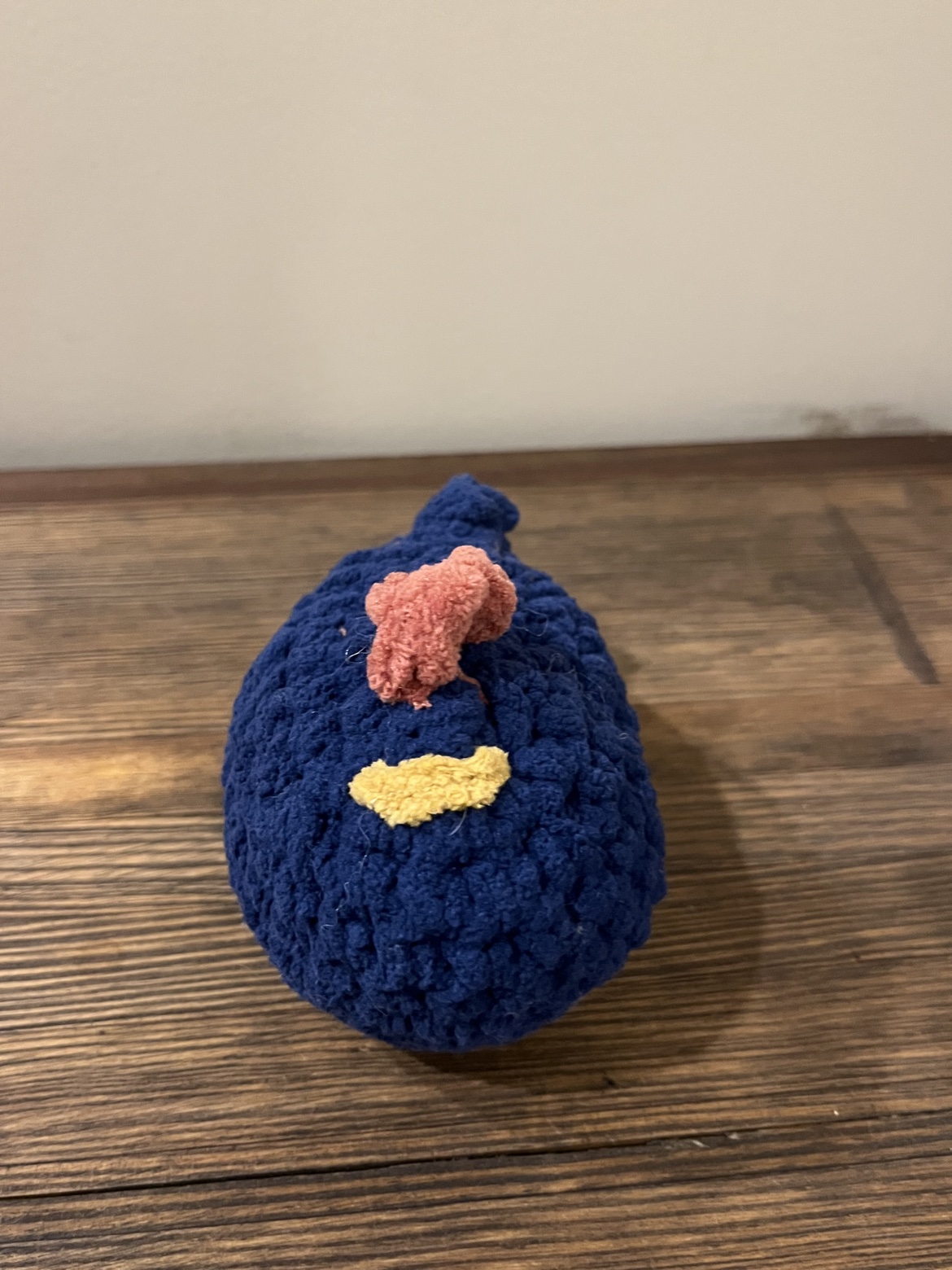 Front view of the crochet blue chicken