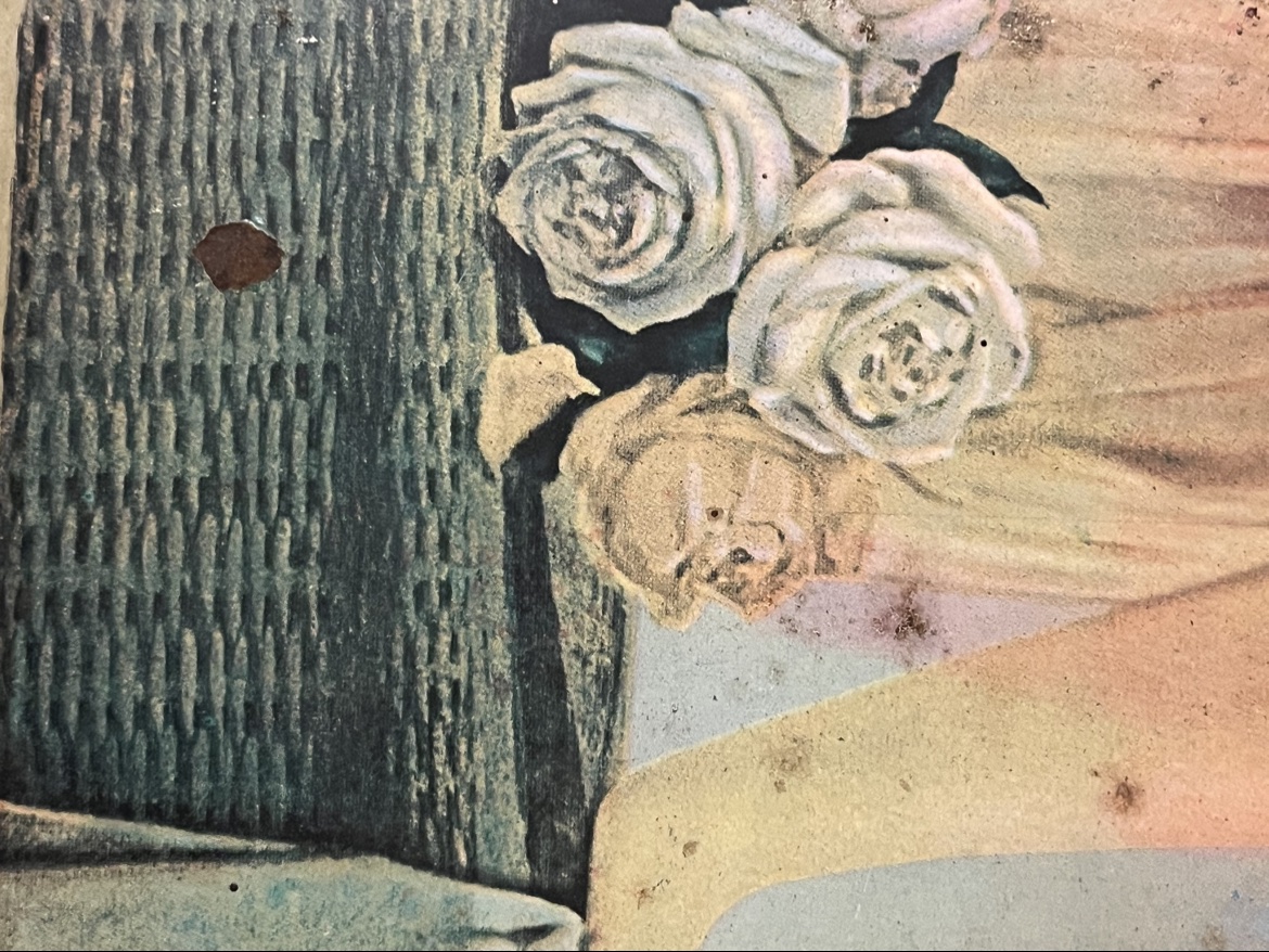 Close-up of the left side and floral details on the Coca Cola advertising tray