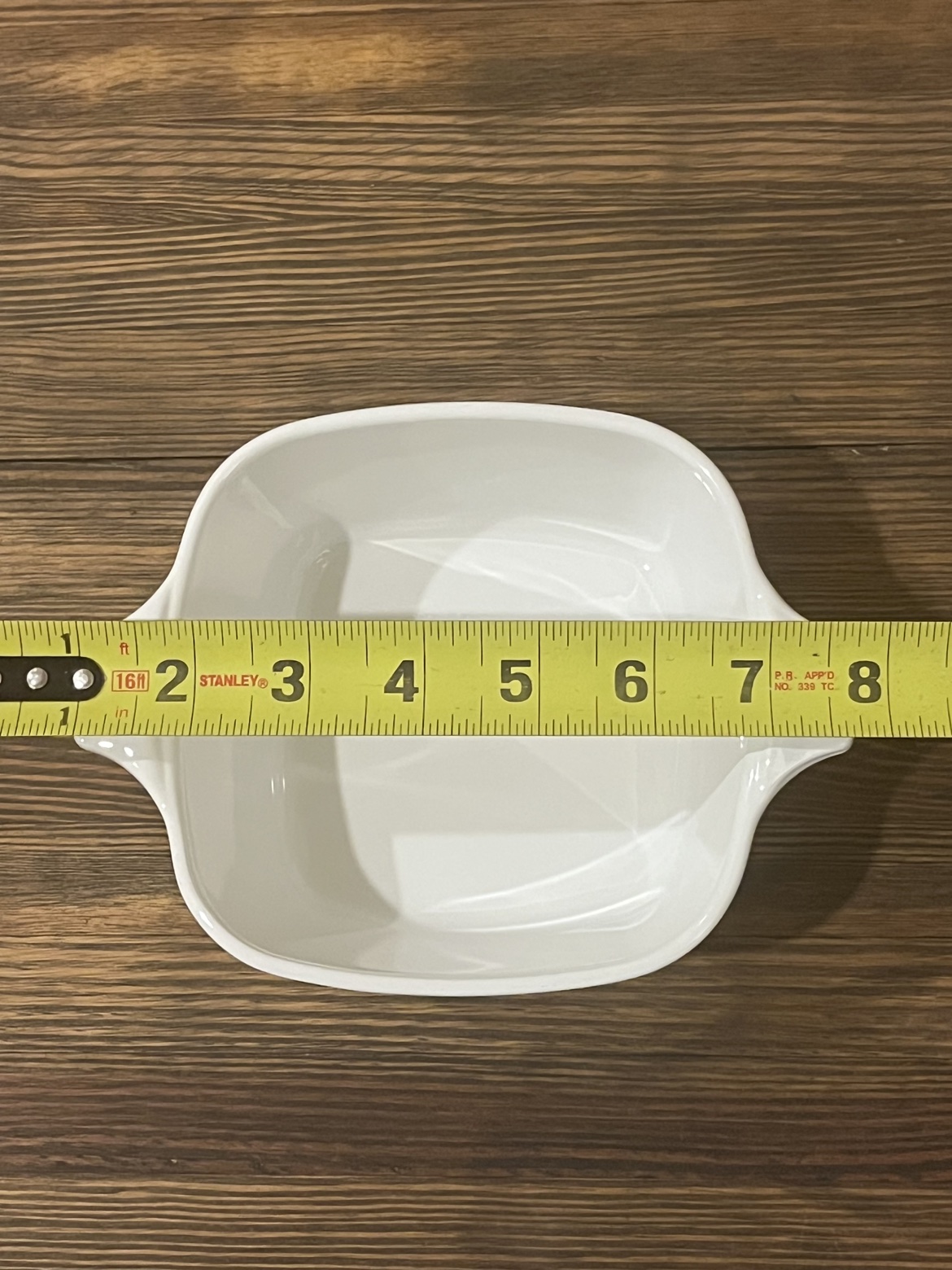 Top-down view with a tape measure showing about 7 inches wide