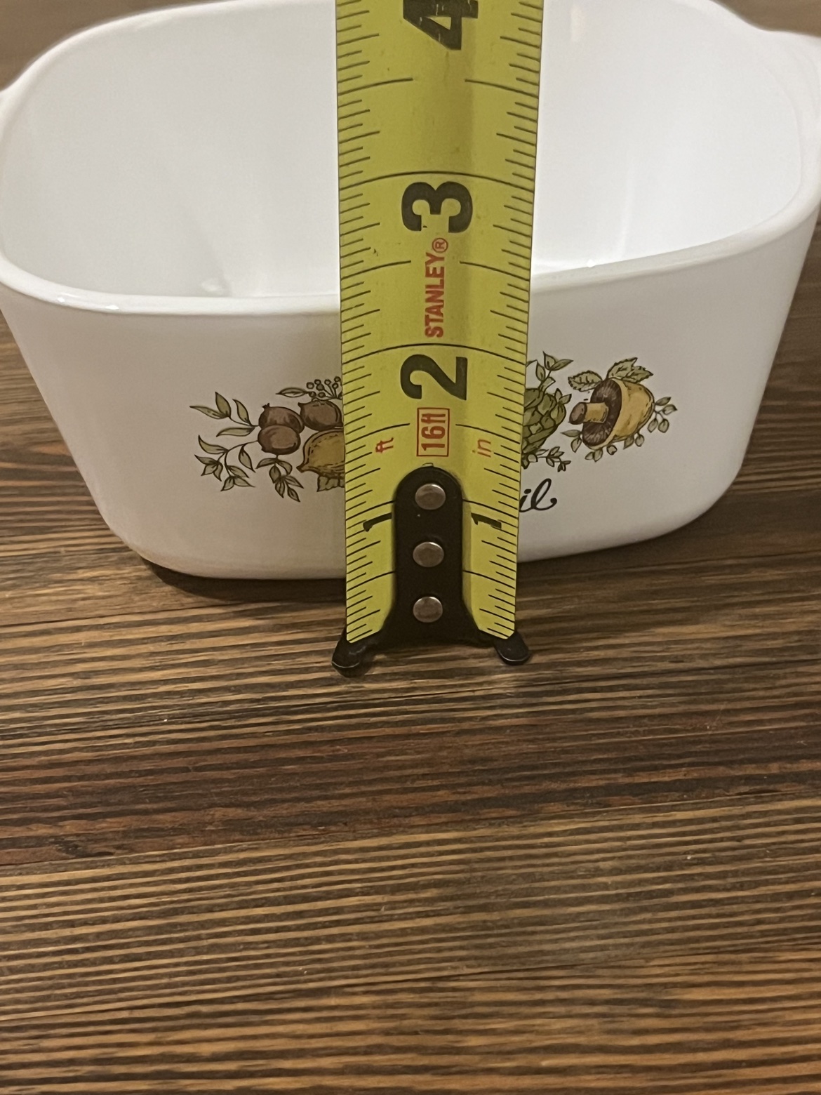 Side view with a tape measure showing about 3 inches tall