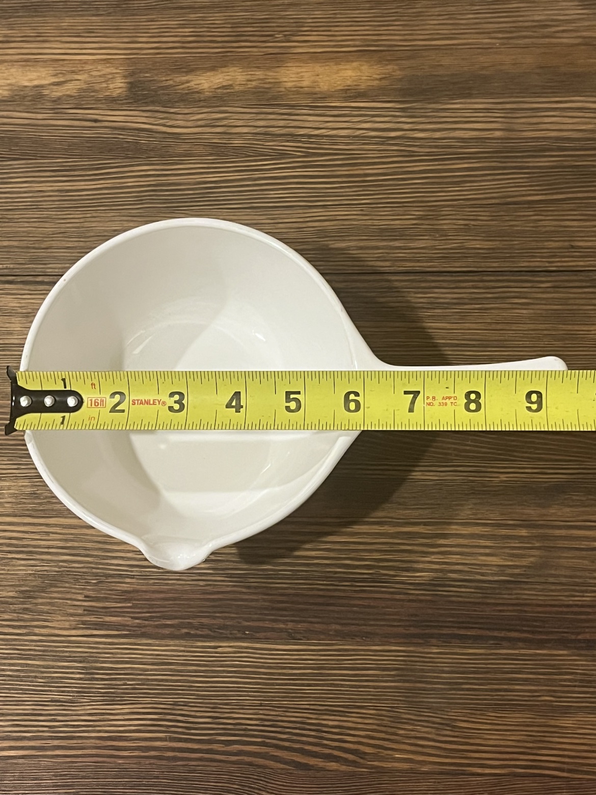 Top-down view with a tape measure showing about 8 and a half inches long