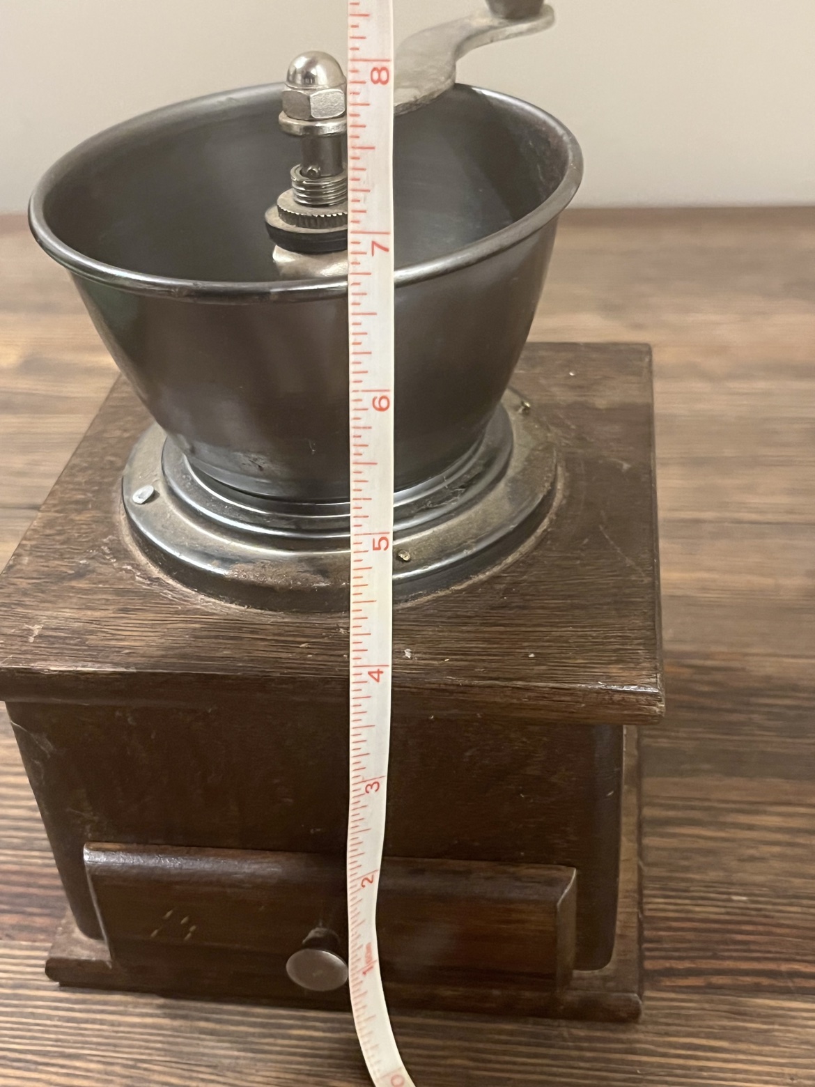 Front view with a tape measure showing about 8 inches tall