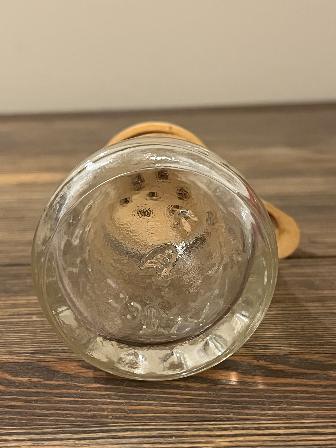 Close-up of the markings on the bottom of one glass shaker
