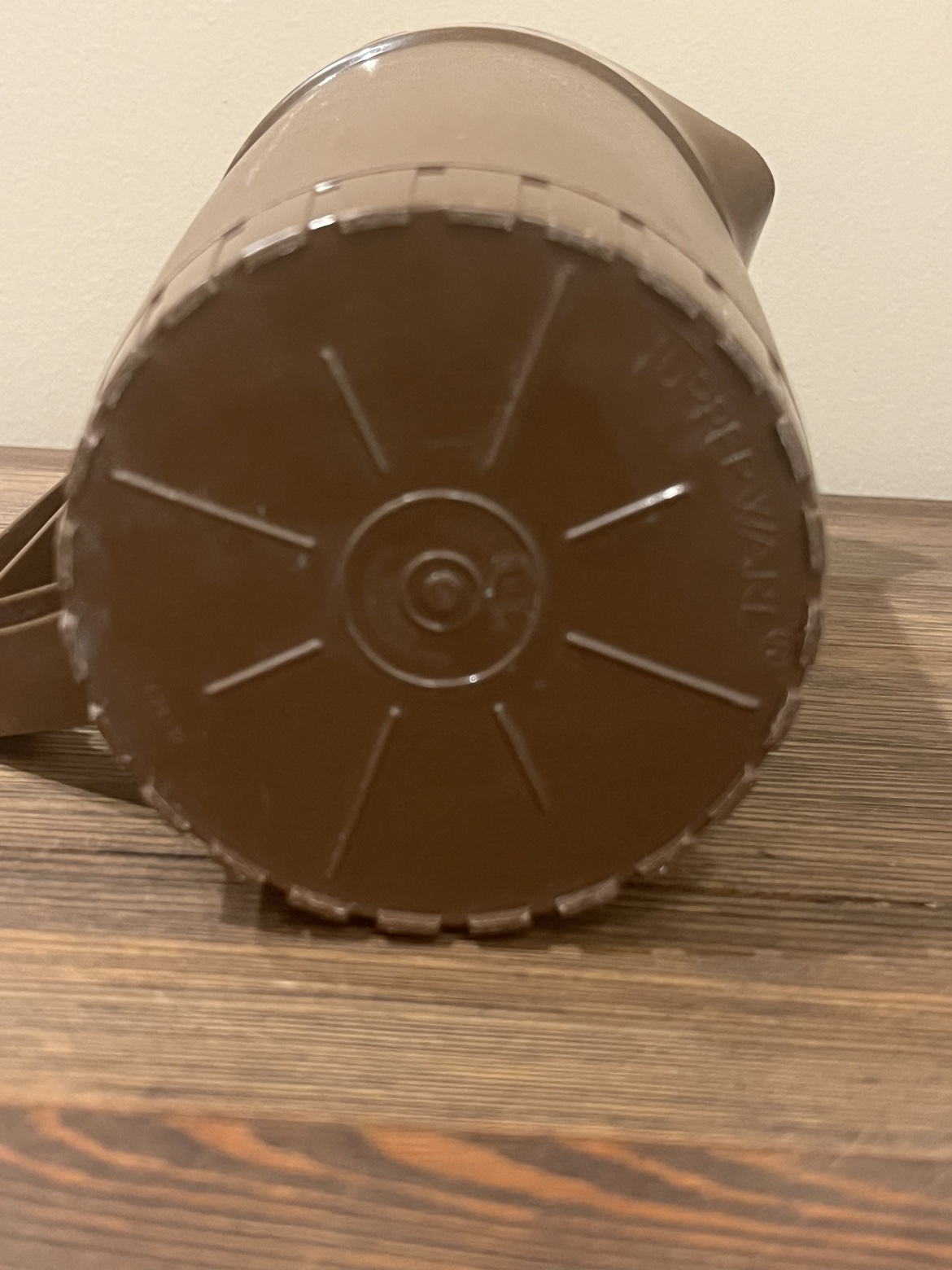 Bottom view of the pitcher showing Tupperware markings