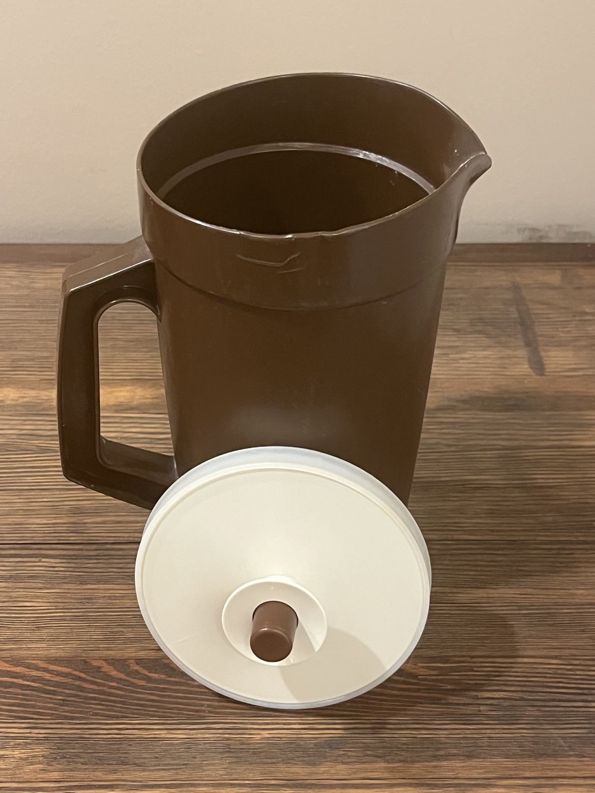 Pitcher with the lid removed and leaning in front, showing the interior